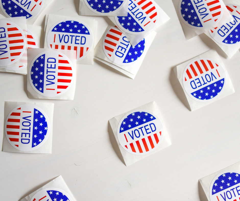 circular stickers with the words I voted