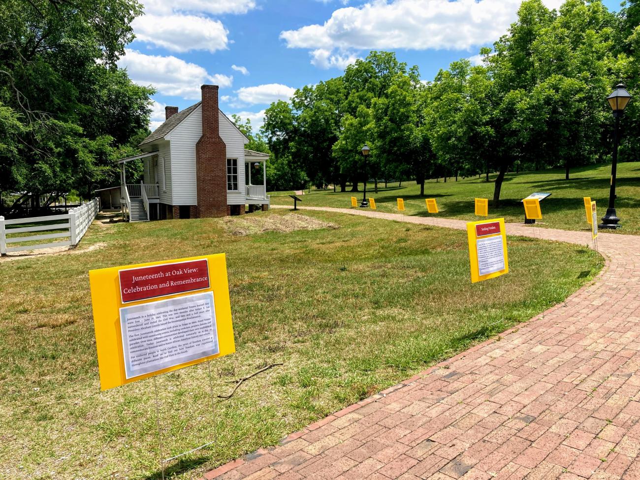 Juneteenth panels along walk at Oak View