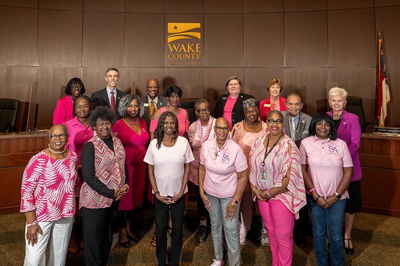 Women dressed in pink join 小黄鸭视频 County Commissioners in board chamber