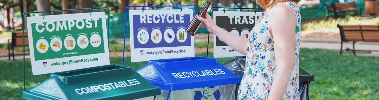 Person Recycling glass bottle into a bin