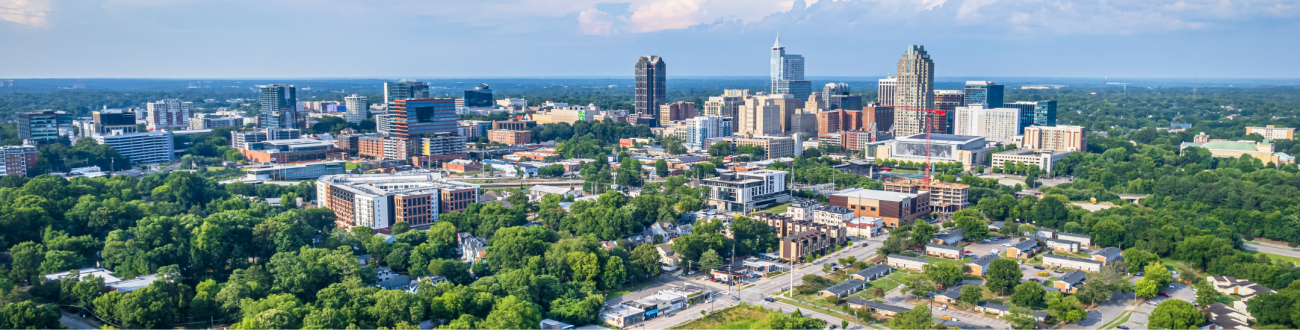 View of downtown Raleigh, North Carolina with blue sky background.