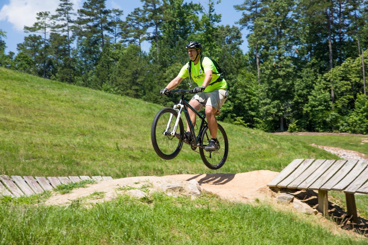 rider on mountain bike goes airborne