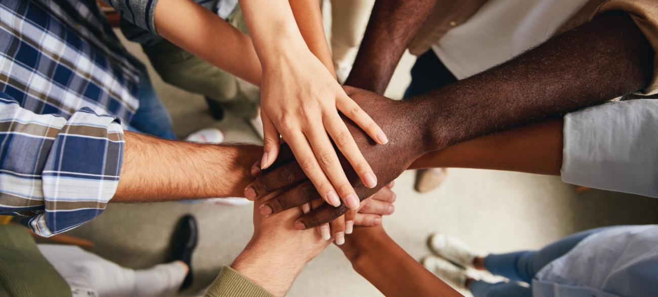 Group of people holding hands