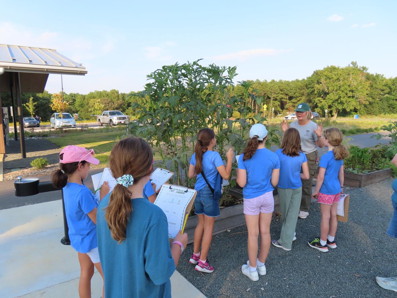 Staff teaching a group program in the Demonstration Garden at Beech Bluff.