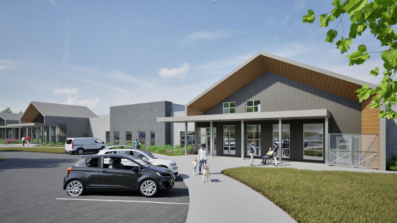 Architectural rendering of a modern animal shelter entrance with a covered porch, large windows, and gray exterior walls.