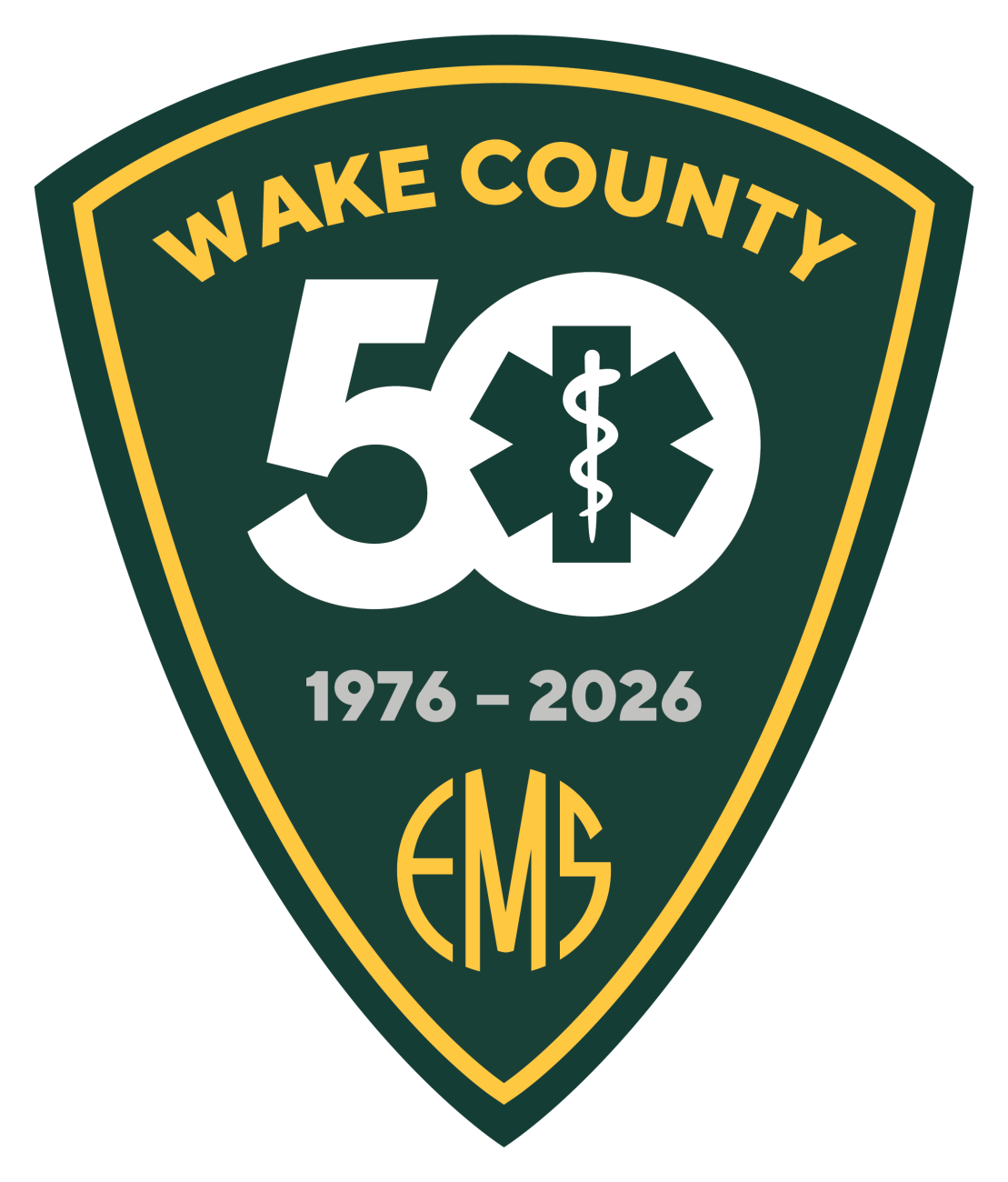 A green shield-shaped emblem reading, "Wake County EMS 50, 1976-2026"