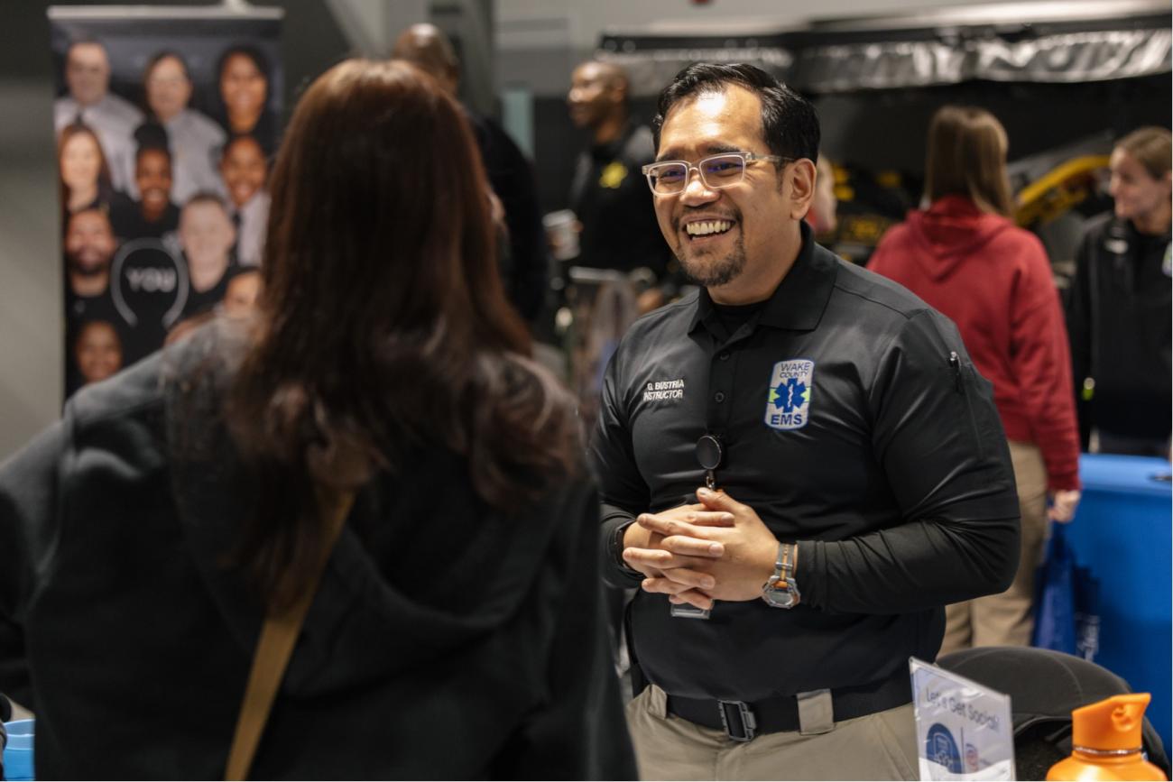 EMS Worker smiling and talking with people