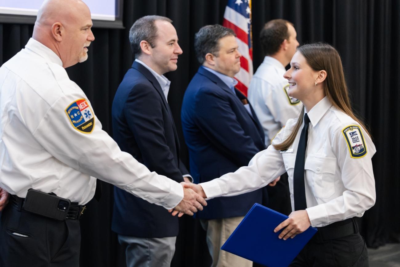EMS Student Shaking hands with Paramedic at Graduation Ceremony