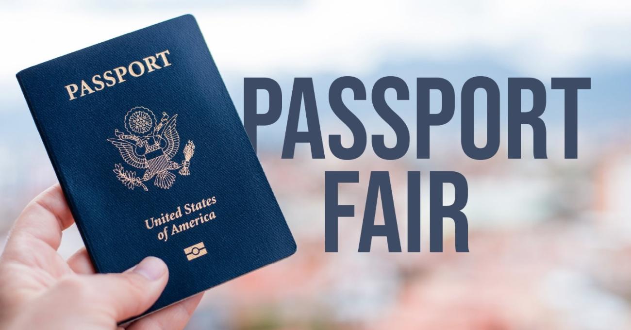 Hand holding a U.S. passport next to the words “Passport Fair.”