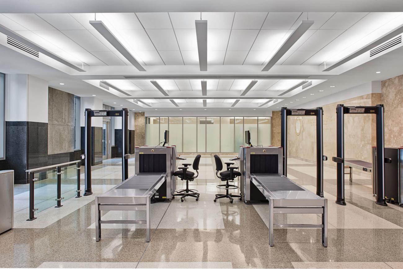 Interior security checkpoint with screening equipment inside a Wake County facility.