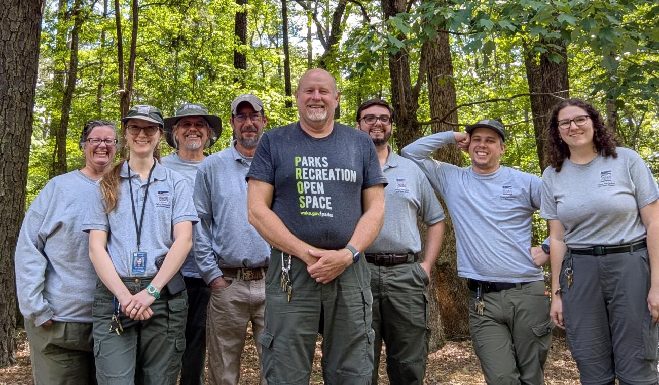 Photo of Harris Lake County Park staff in front of trees