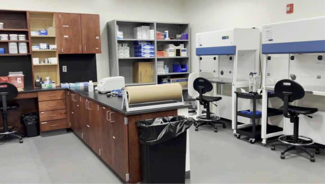 Wake County Bureau of Forensic Services DNA laboratory with workstations, biological safety cabinets and laboratory equipment for forensic evidence analysis.