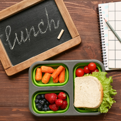 sandwich and notebook laying on a table