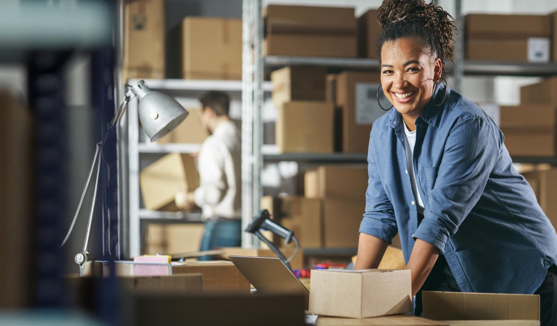 Woman smiling and organizing packages