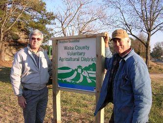 Landowner standing next to VAD sign