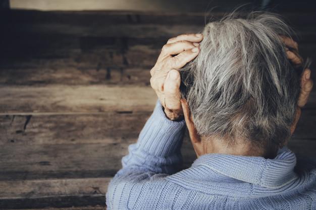 Adult woman holding her head