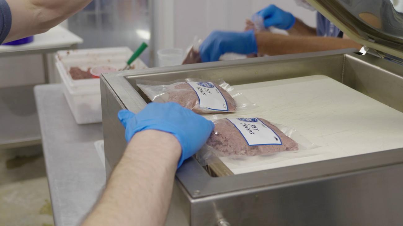 Workers packaging pet treats