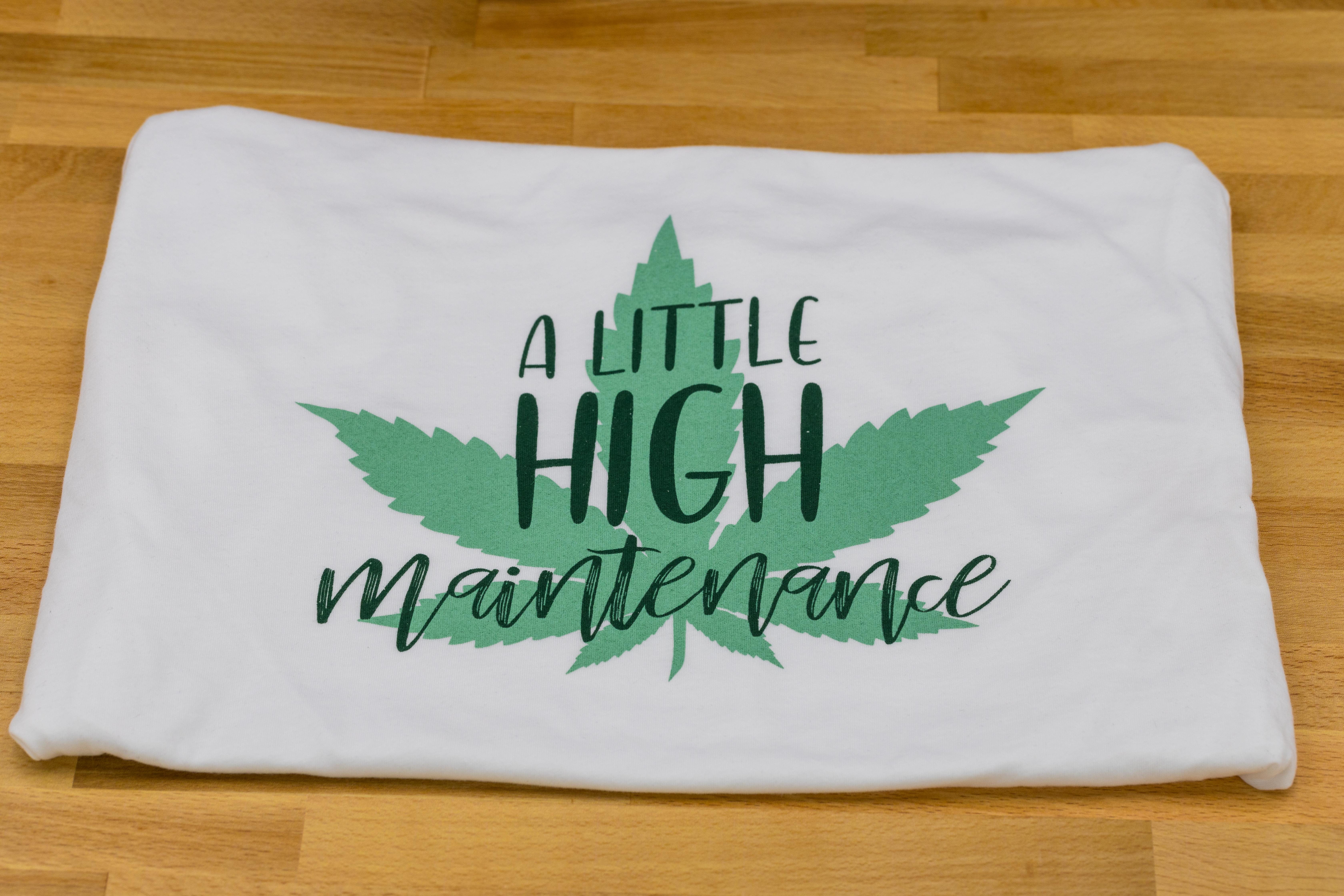 Photograph of product: T-Shirt. XL. White. A Little High Maintenance. Caniba