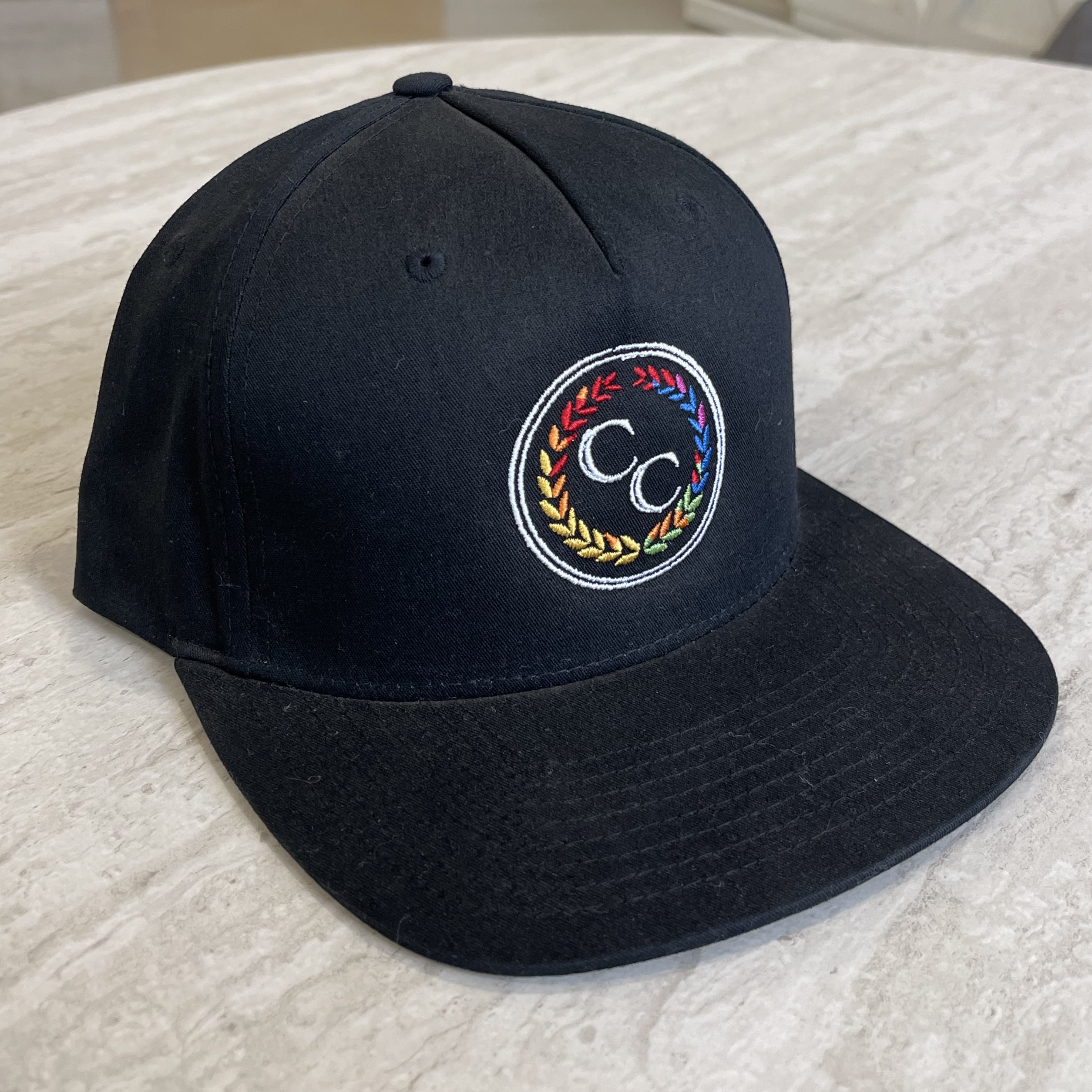 Photograph of product: Oui'd Cured Black Flat Brim Hat