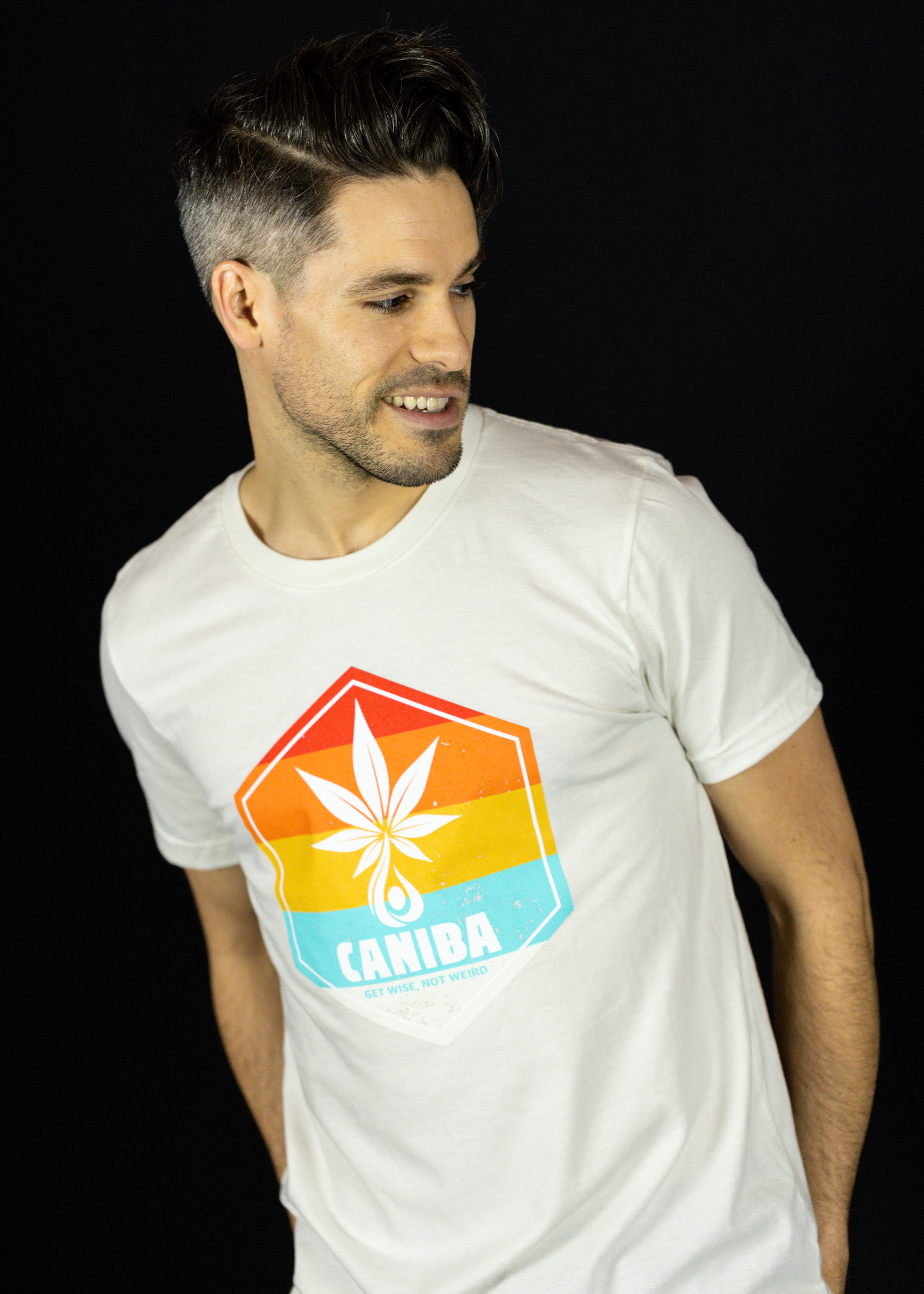 Photograph of product: T-Shirt. L. White. Hexagon Badge. Caniba
