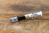 Photograph of product: Farm to Fam Oui'd Energize 1g RSO Syringe