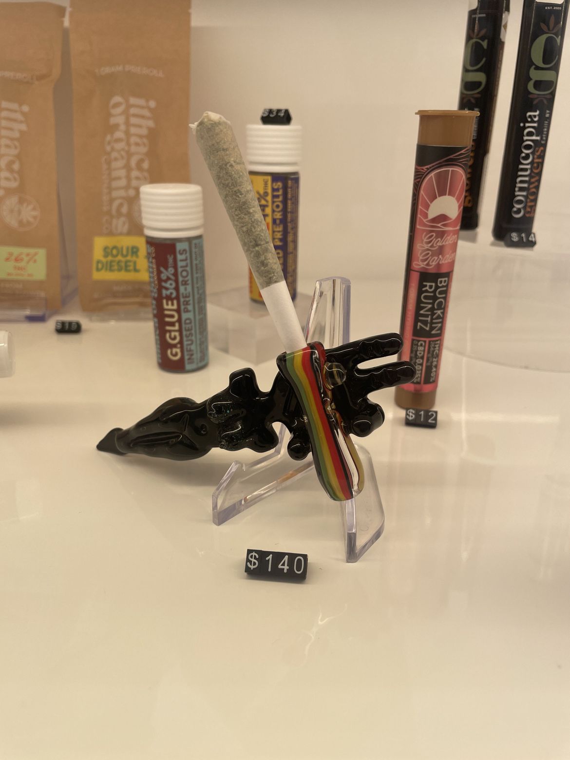 Photograph of product: Goober Doober Joint Accessory and Dab Tool | Heady High End | Female Figure | Black and Rainbow