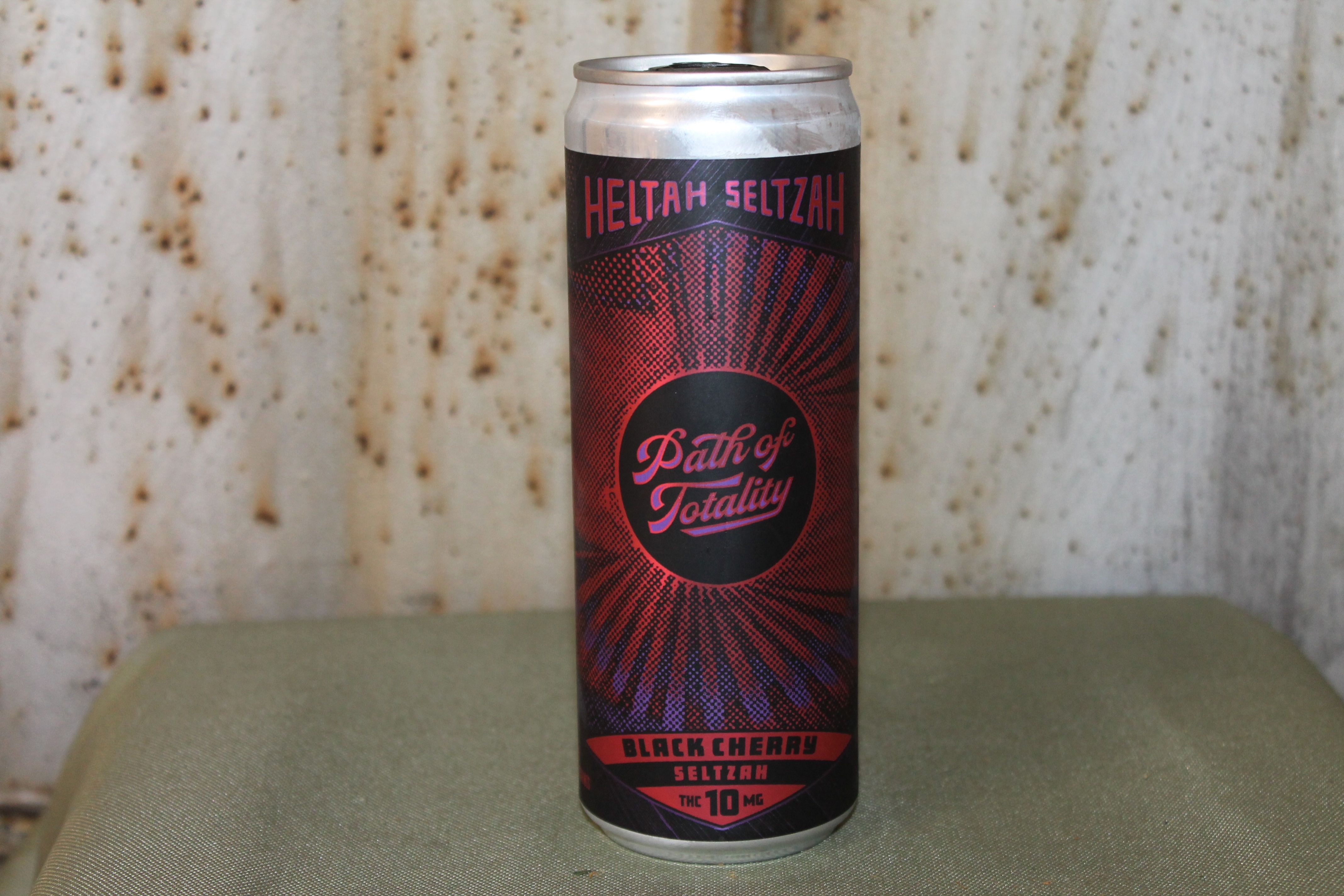 Photograph of product: Taunik I Forbins Black Cherry Seltzer (Path of Totality)