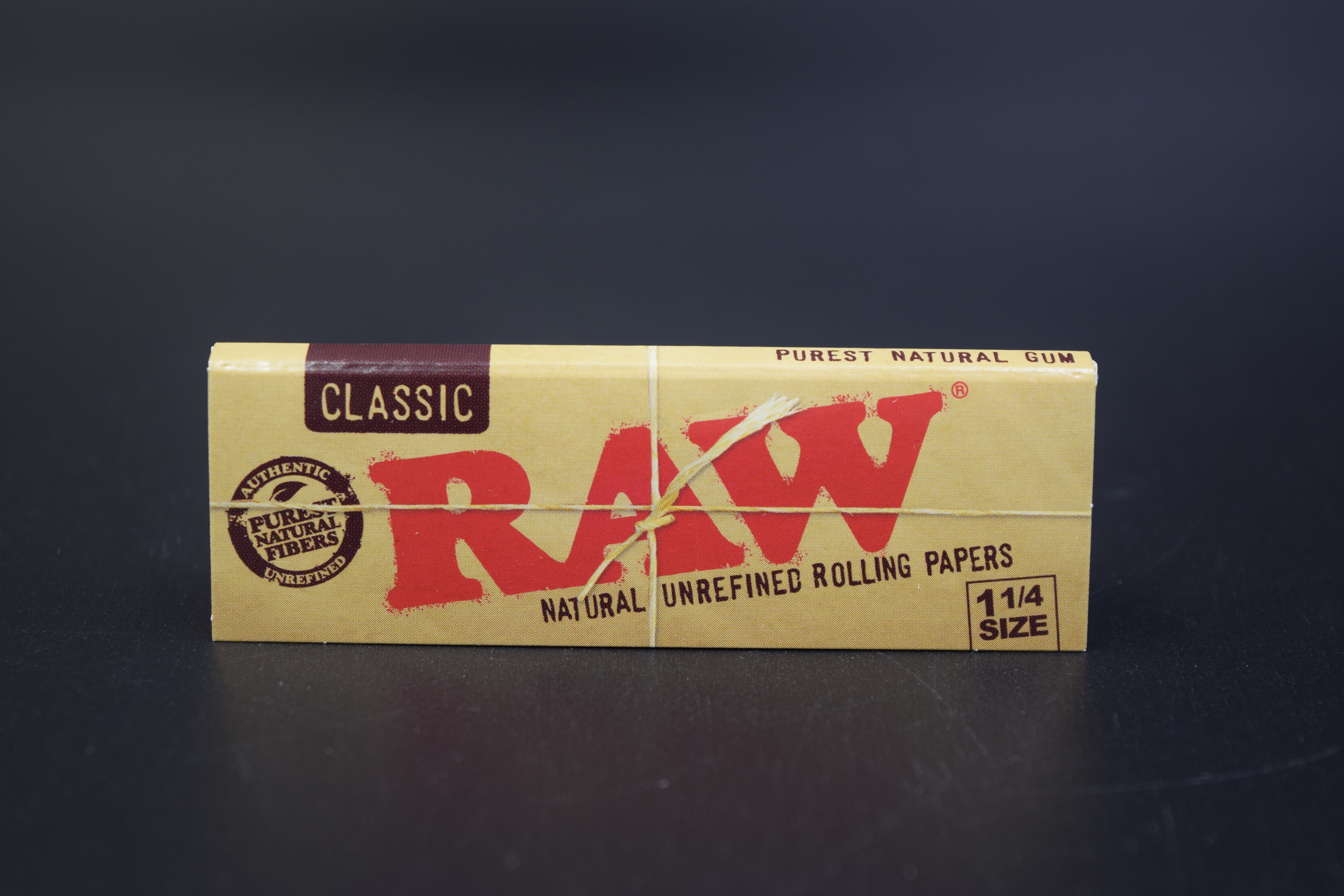 Photograph of product: Raw   Classic 1 1/4" Rolling Paper