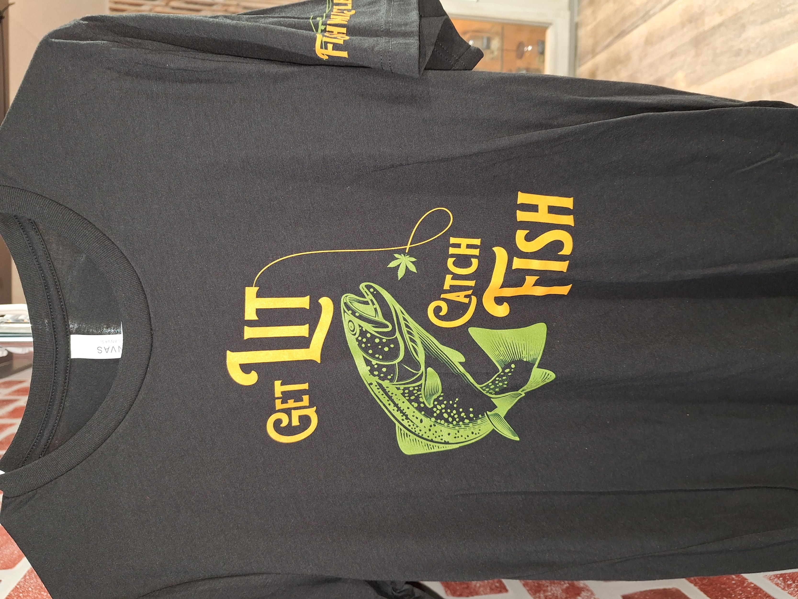 Photograph of Product: Fishwhistle | Get Lit Catch Fish T-shirt