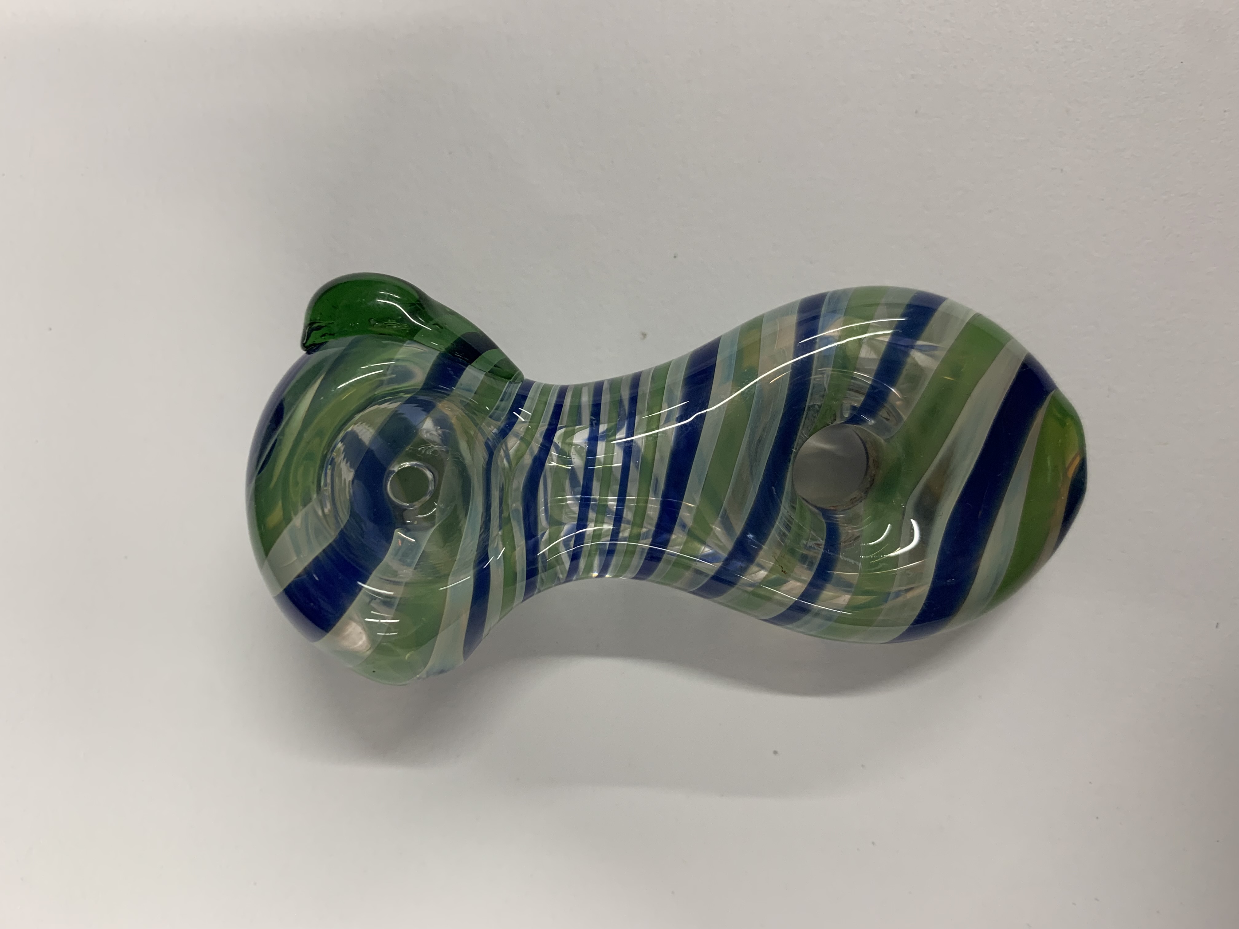 Photograph of product: Glass - 3" Reverse Spiral Striped Color changing Donut Hole Pipe - P3139