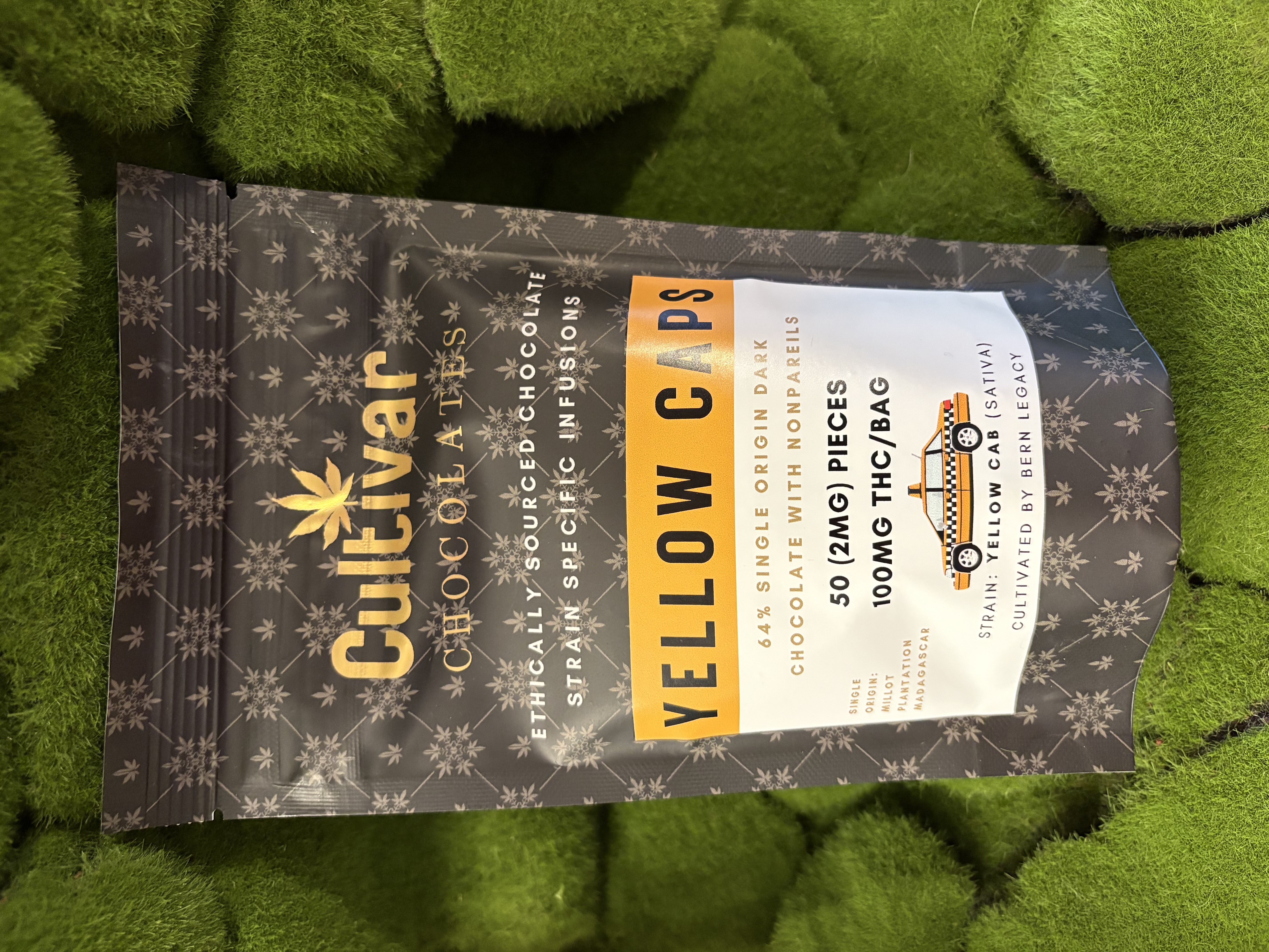 Photograph of product: 50mg Edible Pack | Milk Chocolate Yellow Caps | Cultivar Chocolates