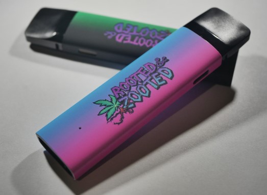 Photograph of product: Rooted and Zooted Dual Flavors Live Resin Vape - Purple Ice Water/ Rainbow Wreck