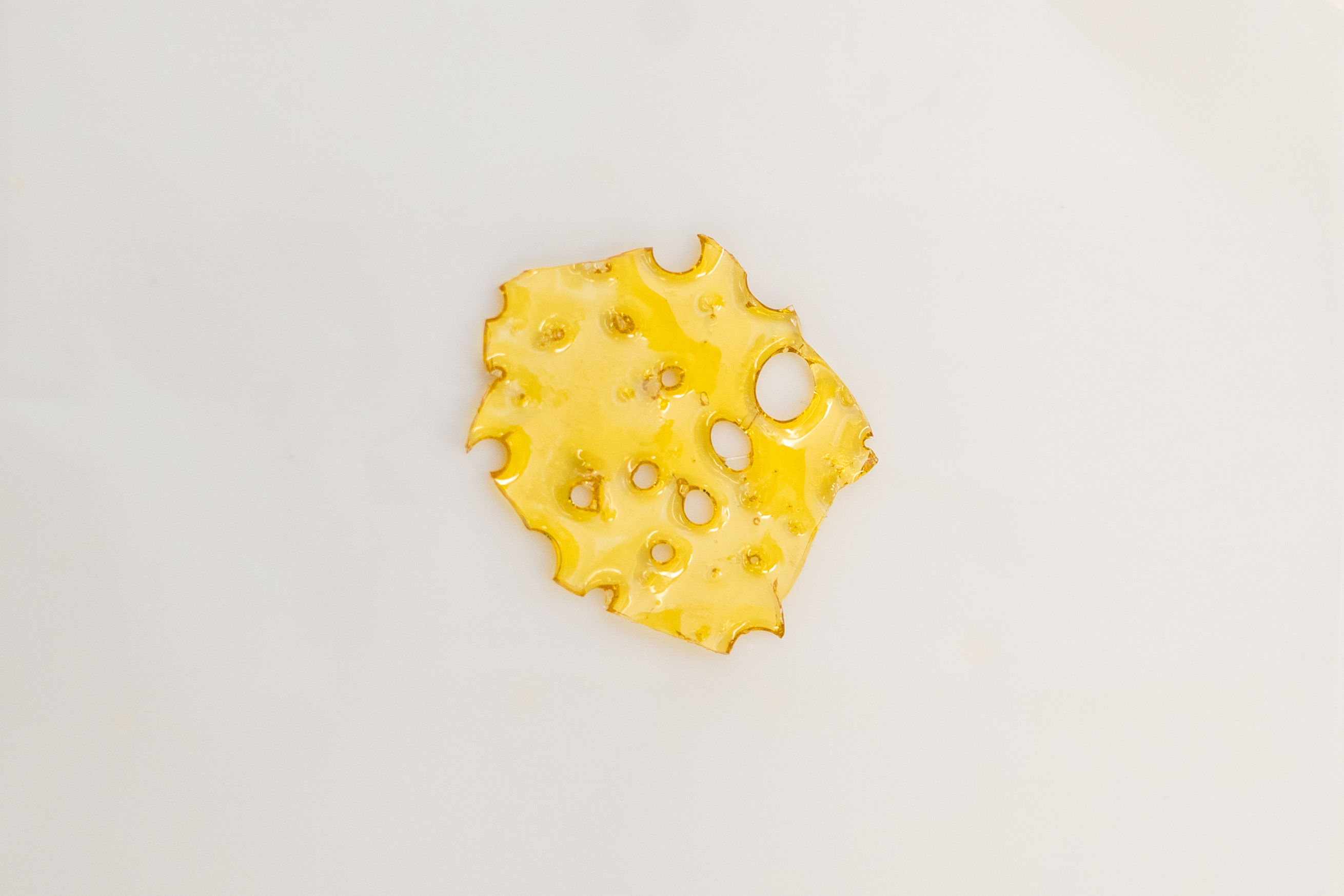 Photograph of product: SunMed - Snoop Dogg OG - Cured Resin Shatter