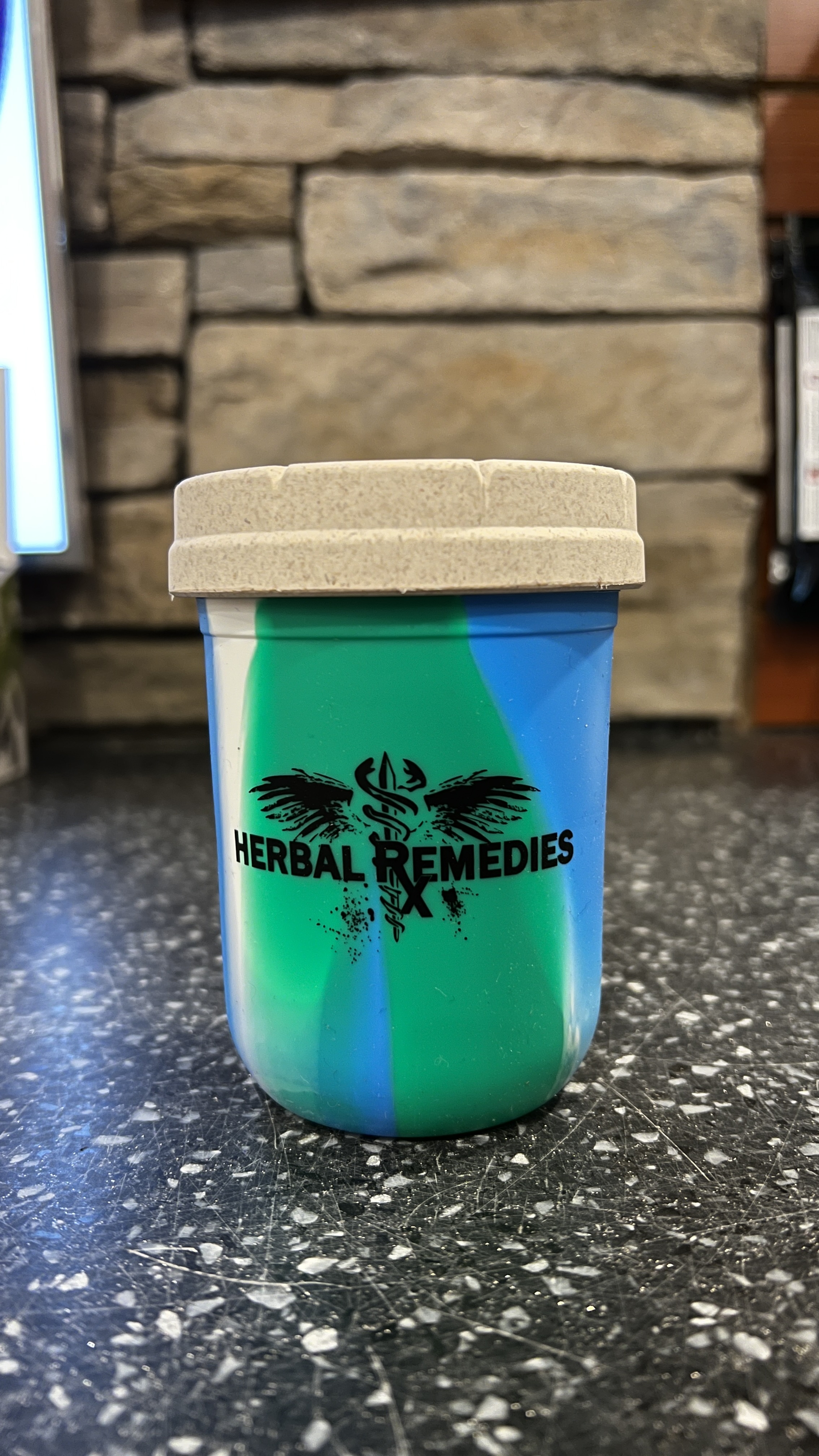 Photograph of product: 4oz Re Stash Rasta (Tie-Dye White Lid)