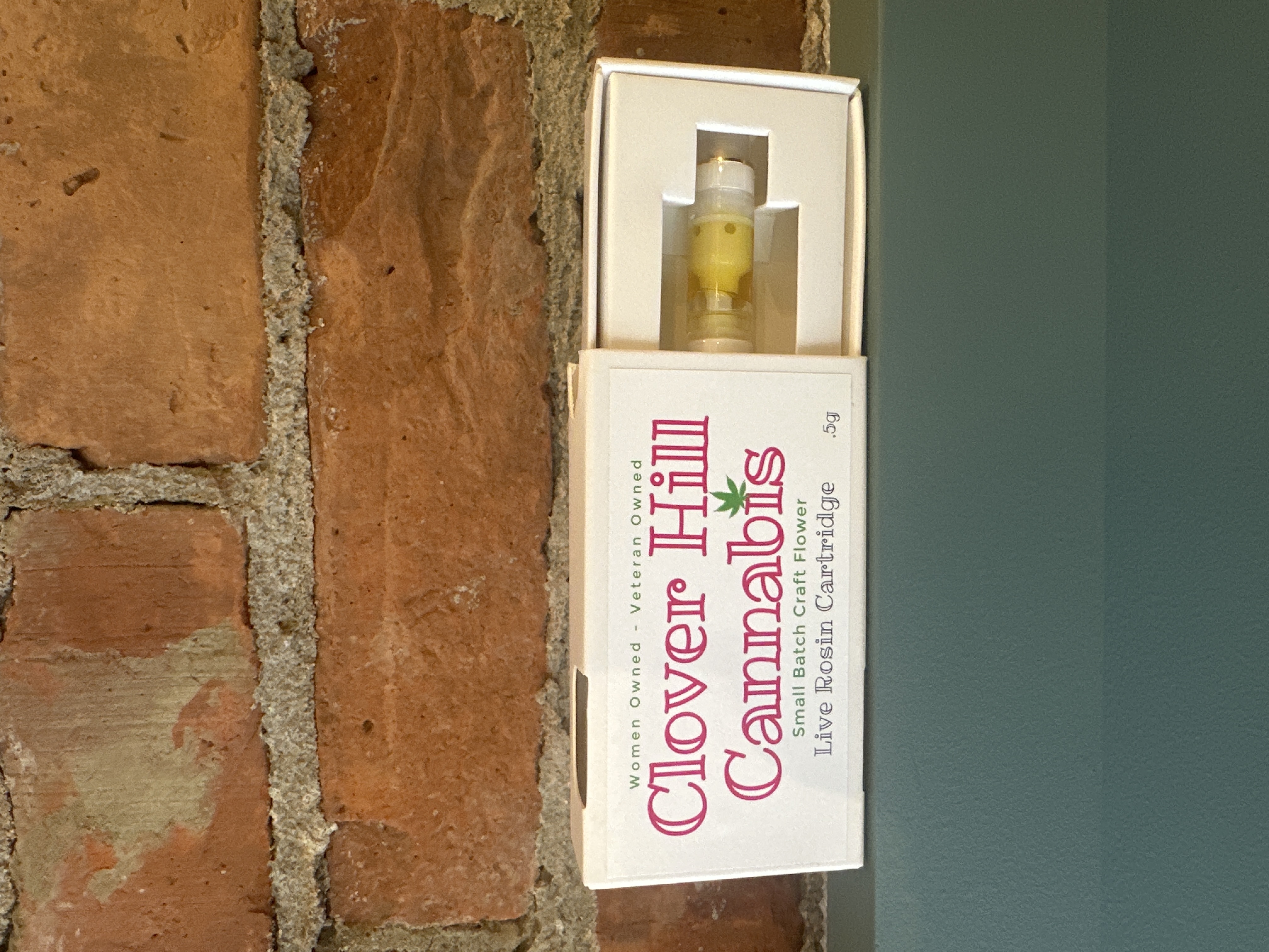 Photograph of product: Clover Hill Oui'd Live Rosin Vape Cart | Hella Jelly