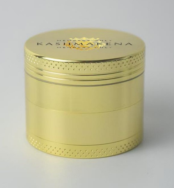 Photograph of product: KashMakena - 63mm Zinc 4-Piece Grinder - Gold (Assorted Designs)