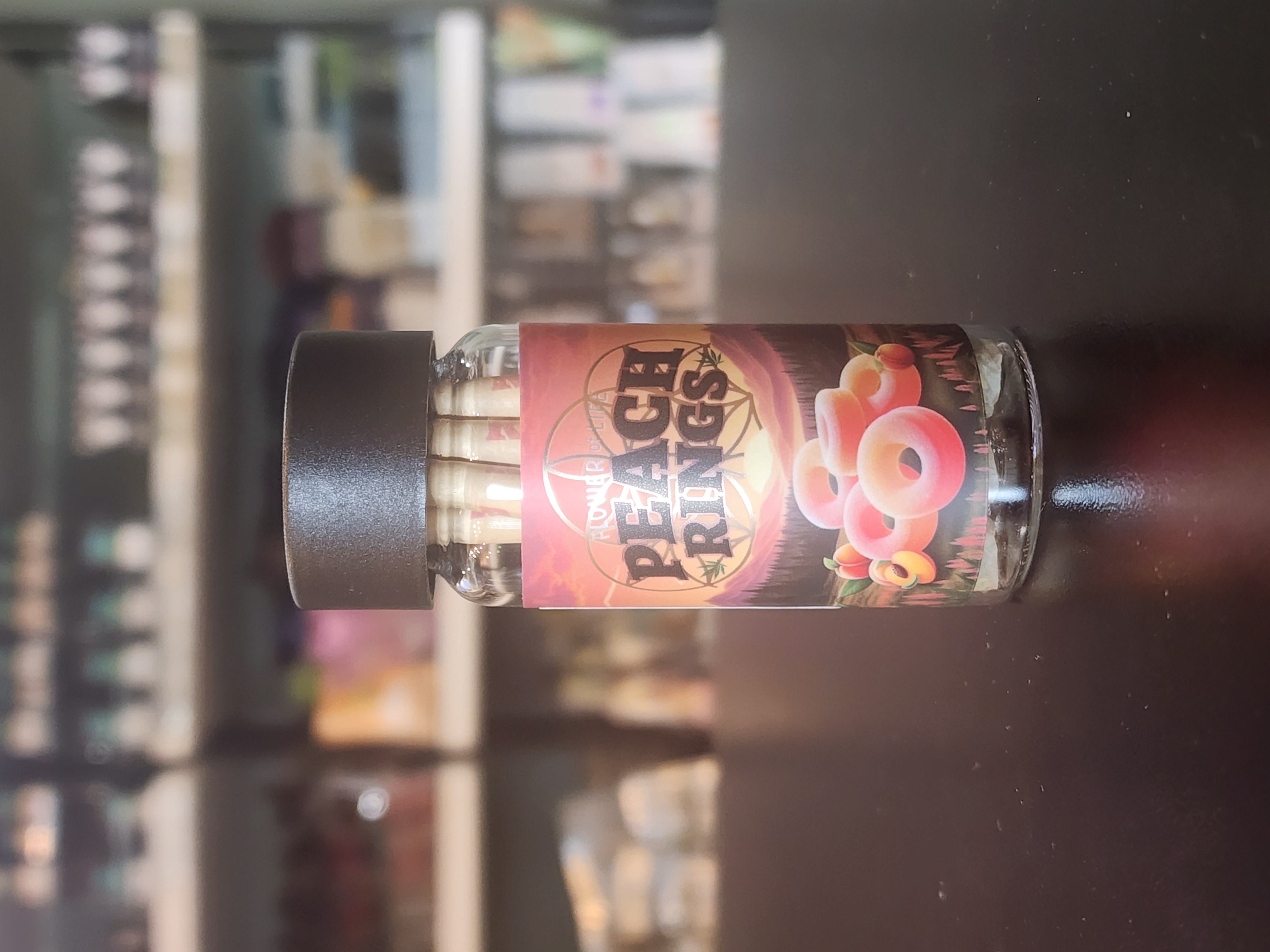 Photograph of product: 0.7G PEACH RINGS PRE-ROLL 5-PACK