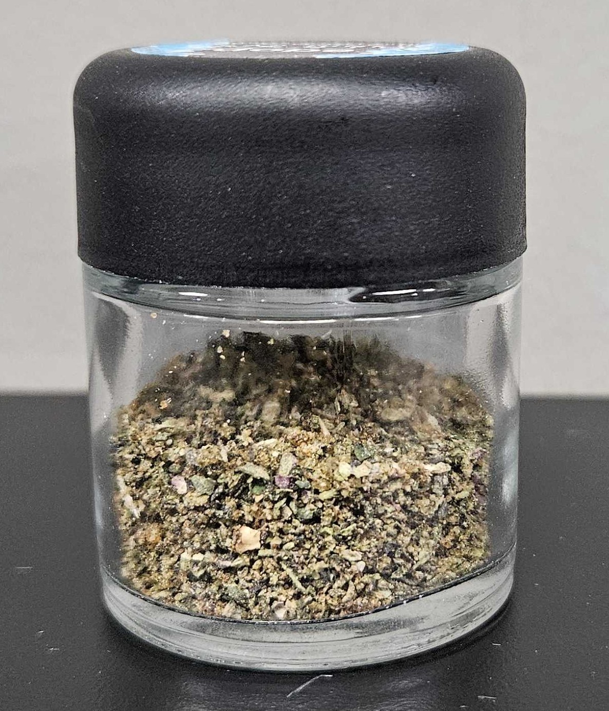 Photograph of product: DOPE | Prepackaged | Infused Shake | Super Secret Kush x Cap Junky