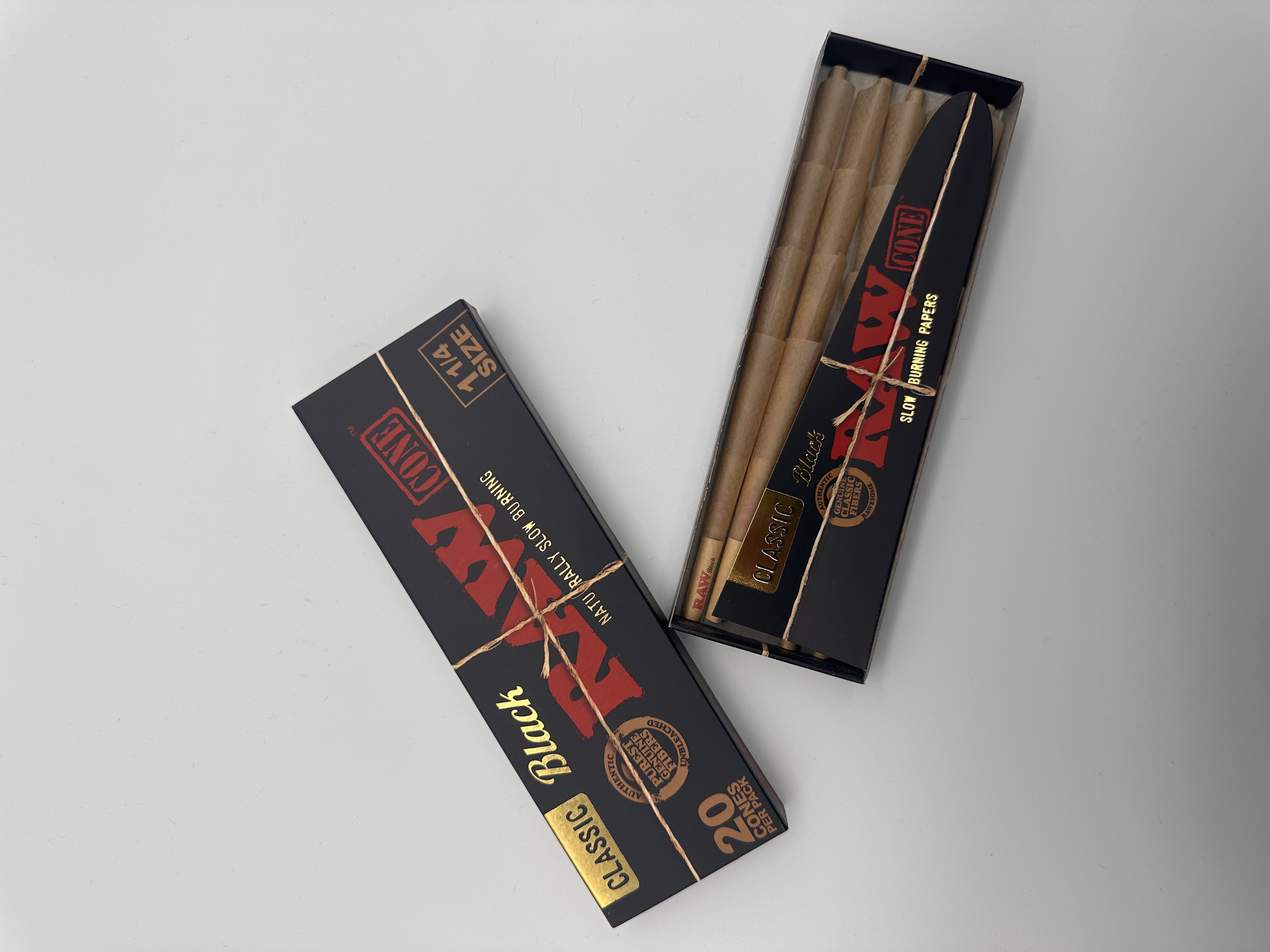 Photograph of product: Raw | Black Pre Roll Cones | 1 1/4 Size | 20pk