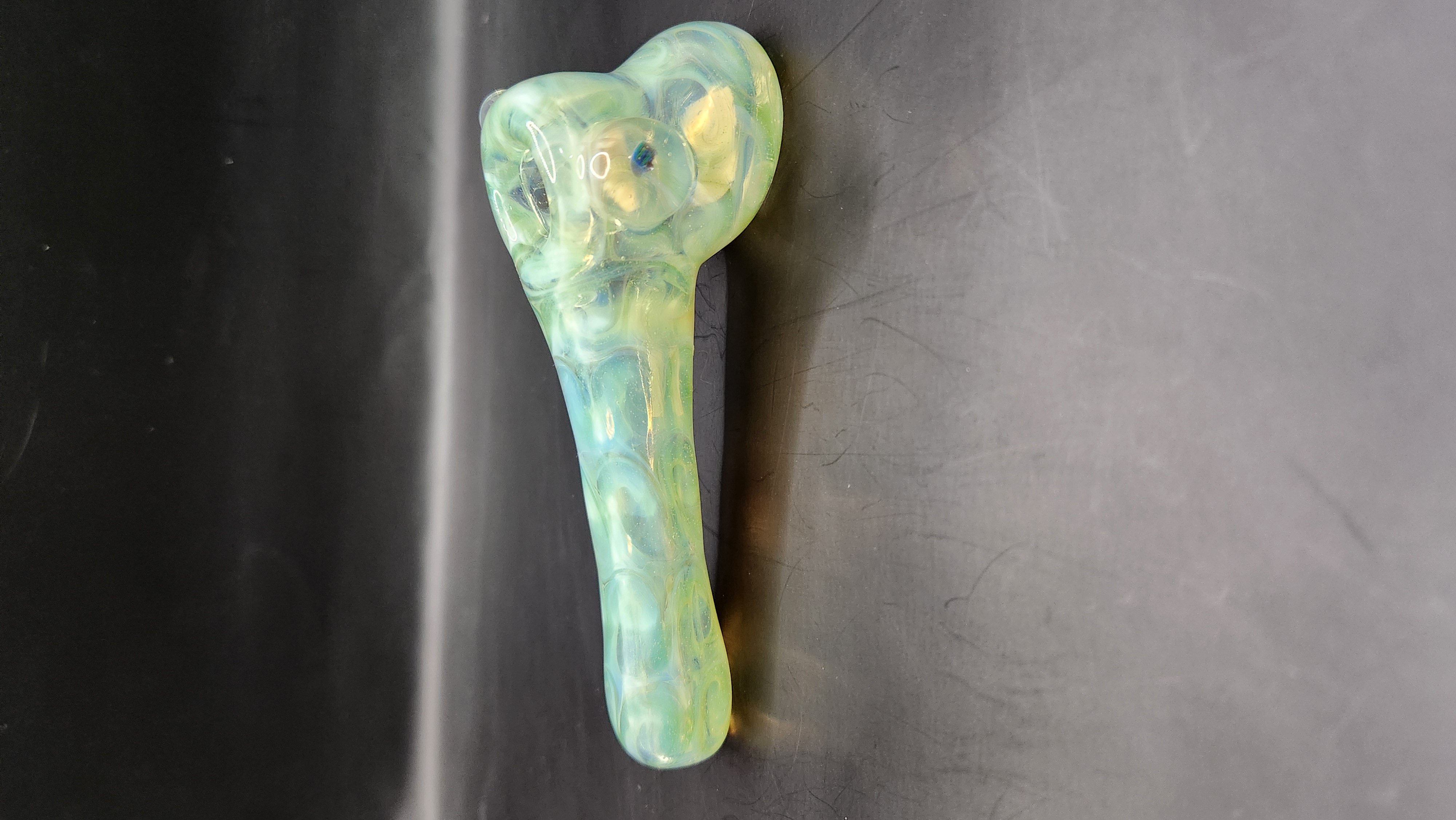 Photograph of product: Glass - Snakeskin - pipe w/ rainbow quartz inset thumbrest