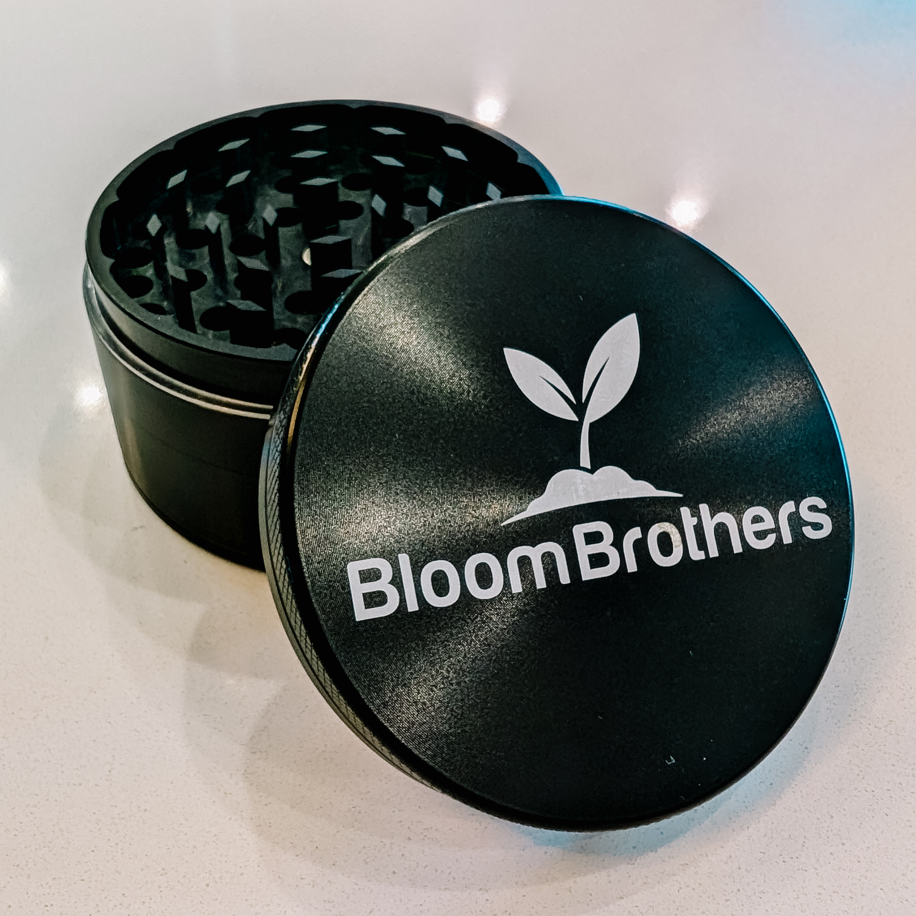 Photograph of product: 2.5" 4 Piece Cali Crusher x Bloom Brothers Grinder - Black