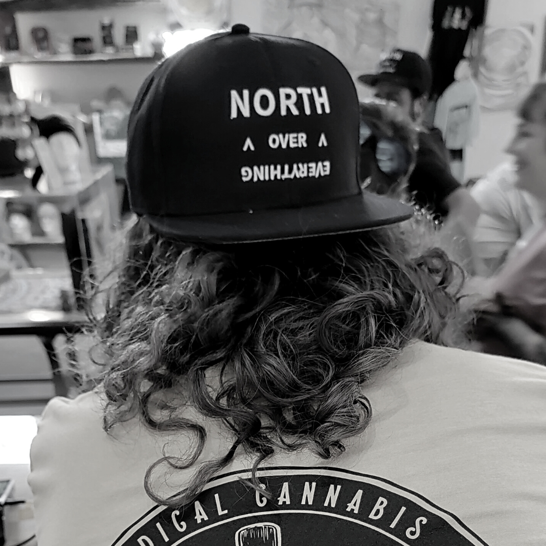 Photograph of product: Chesapeake Apothecary | Clinton Series "NORTH OVER EVERYTHING" LOGO SNAPBACK | BLACK