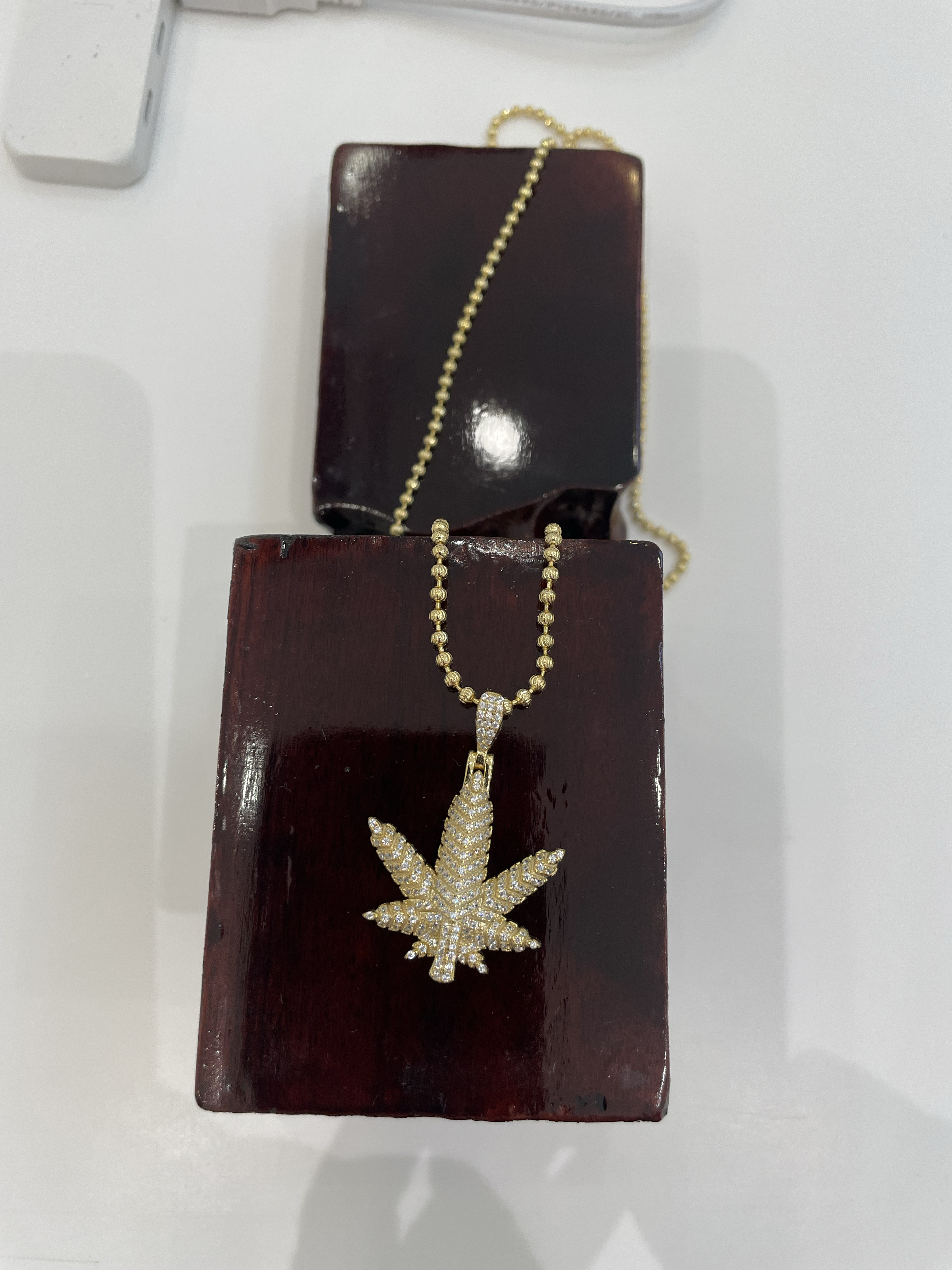 Photograph of product: Brooklyn or Bust | Happy Leaf Charm | Gold