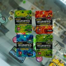 Photograph of product: HELLAVATED - EDIBLE GUMMY - 100MG - SPICY PINEAPPLE