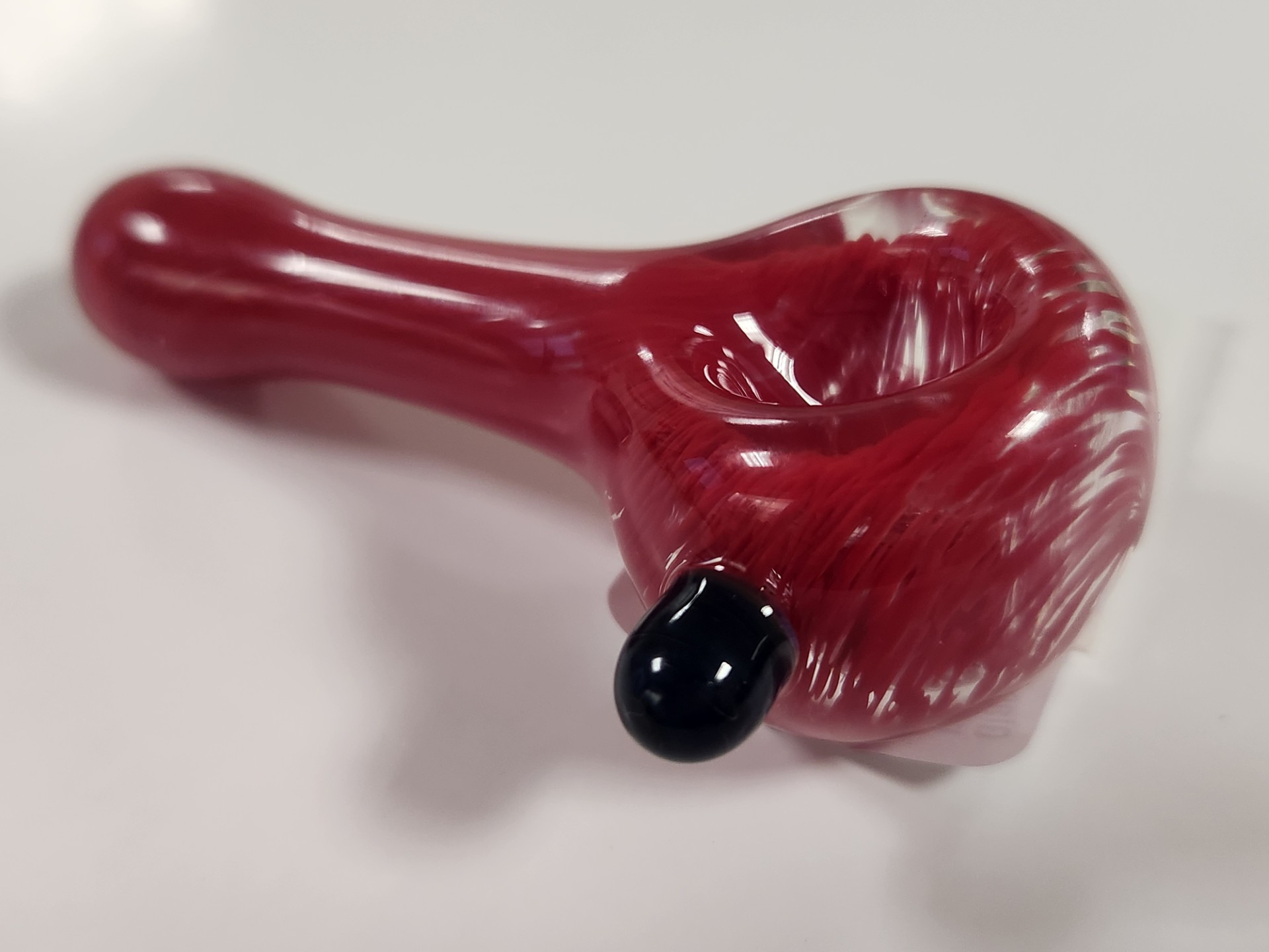 Photograph of product: Glass Spoon I Red Swirl I Highly Elevated