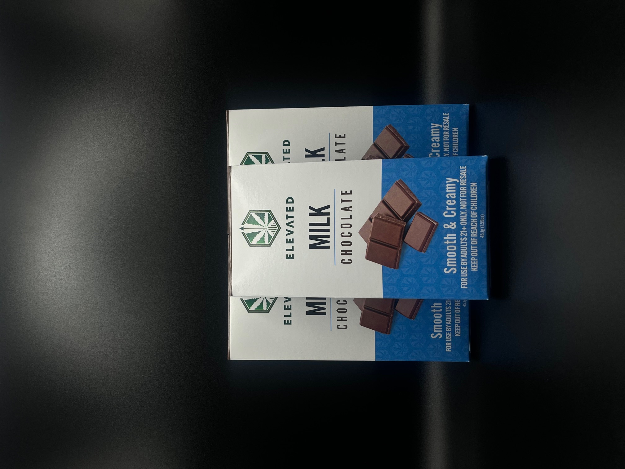 Photograph of product: Elevated - Milk - 100mg Oui'd - Live Chocolate