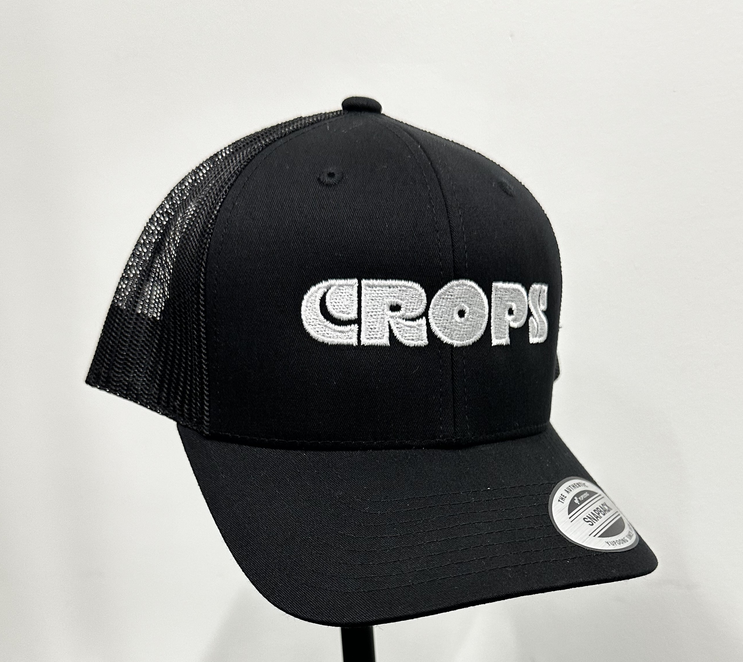 Photograph of product: Black Crops Snapback Hat