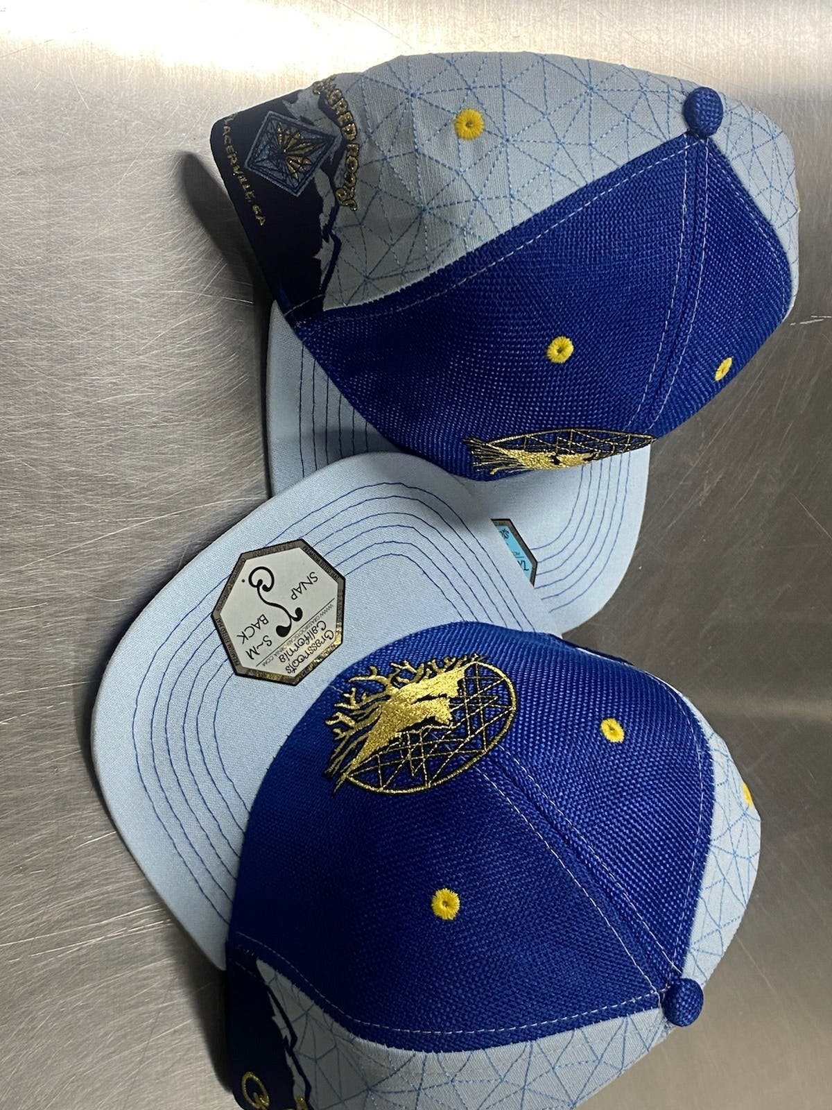 Photograph of product: Sacred Roots Blue Hat w/ Gold Logo L/XL