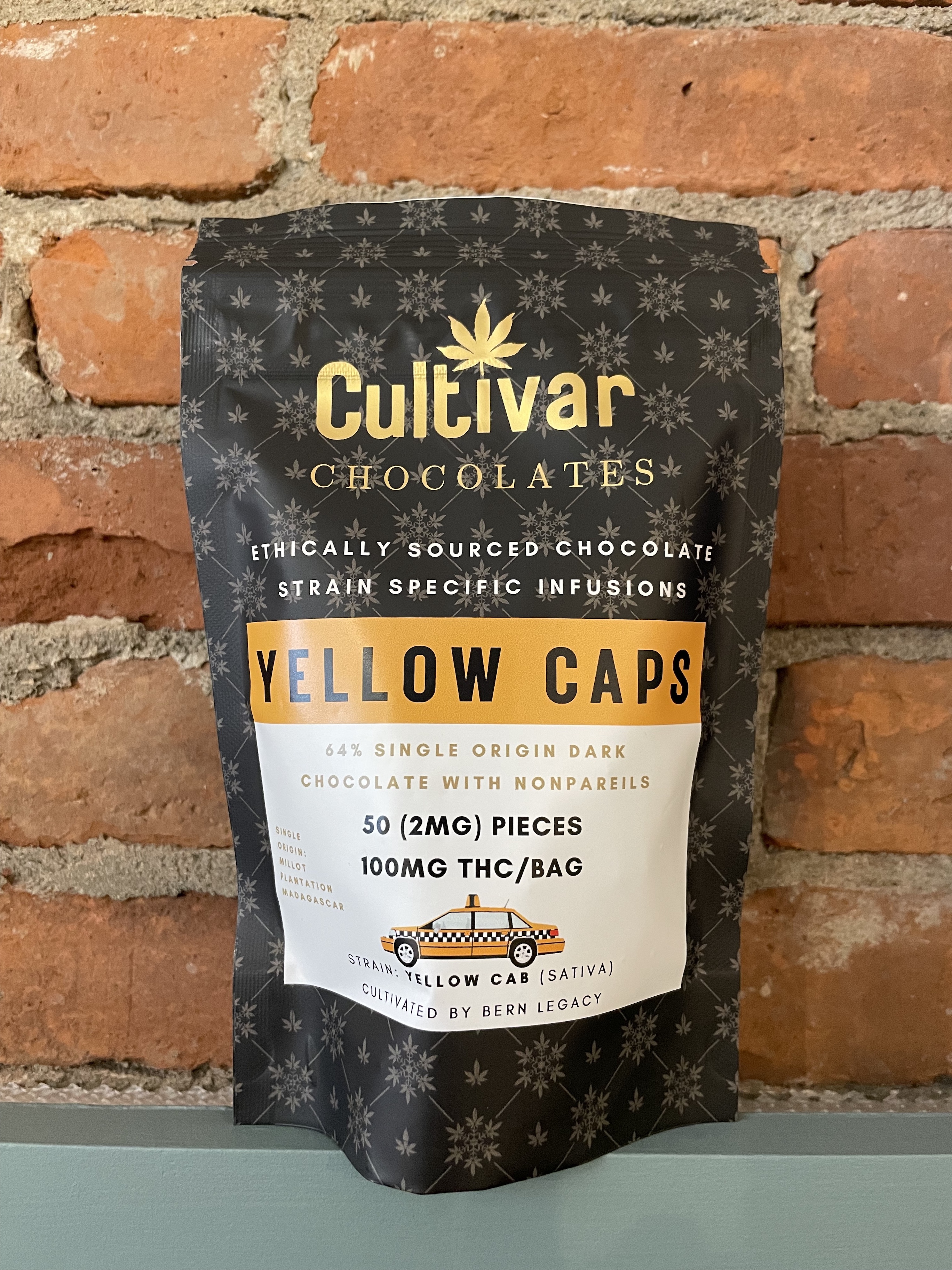 Photograph of product: Cultivar Chocolates | 100mg TH-oui Chocolate Drops | Yellow Caps