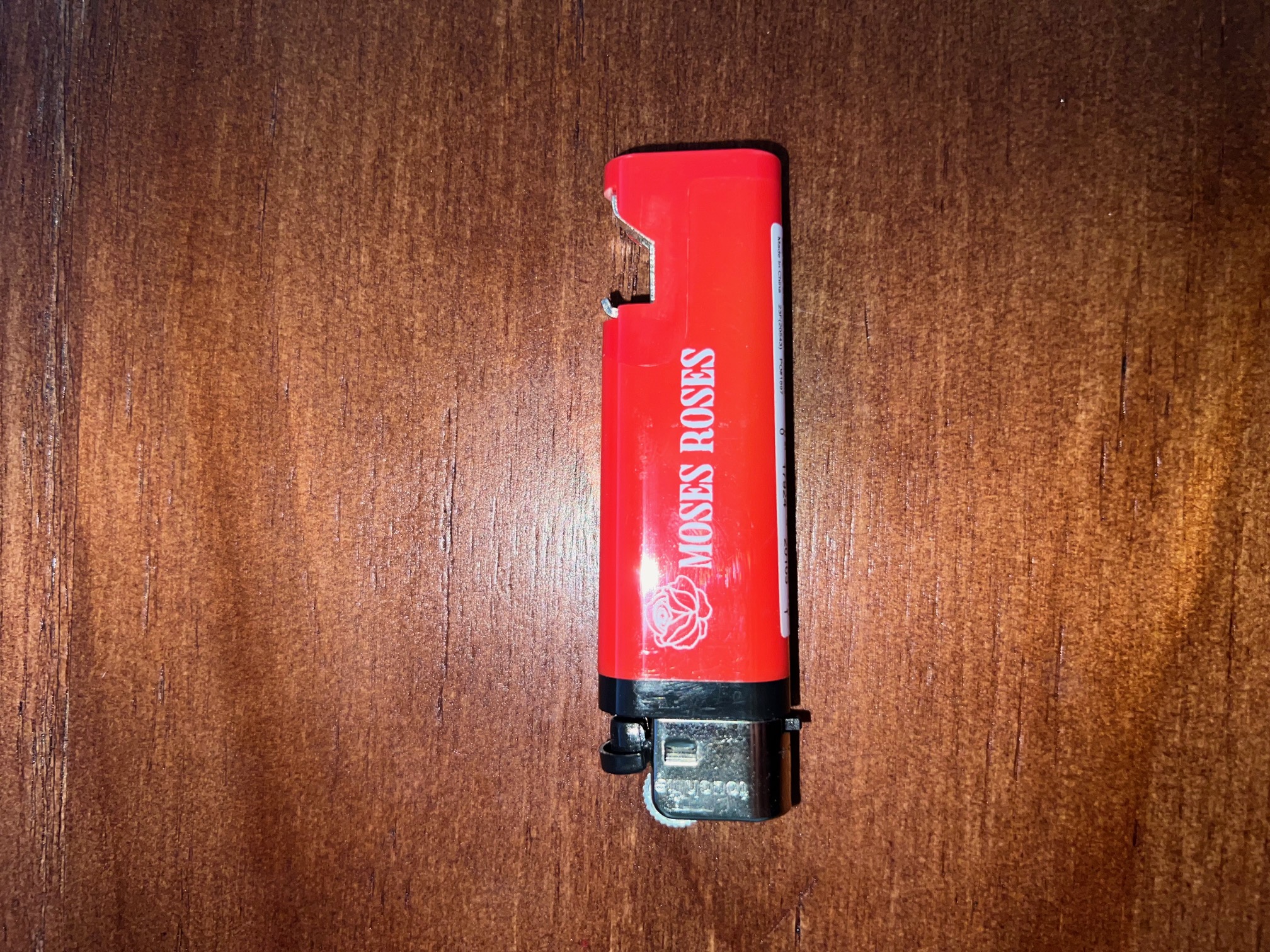 Photograph of product: Moses Roses - Lighter with Bottle Opener